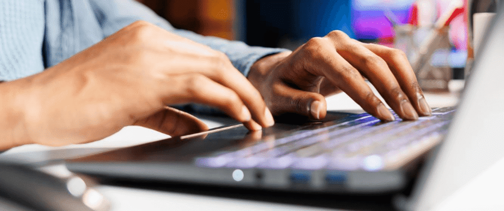 Business owner reviewing SEO basics on a laptop